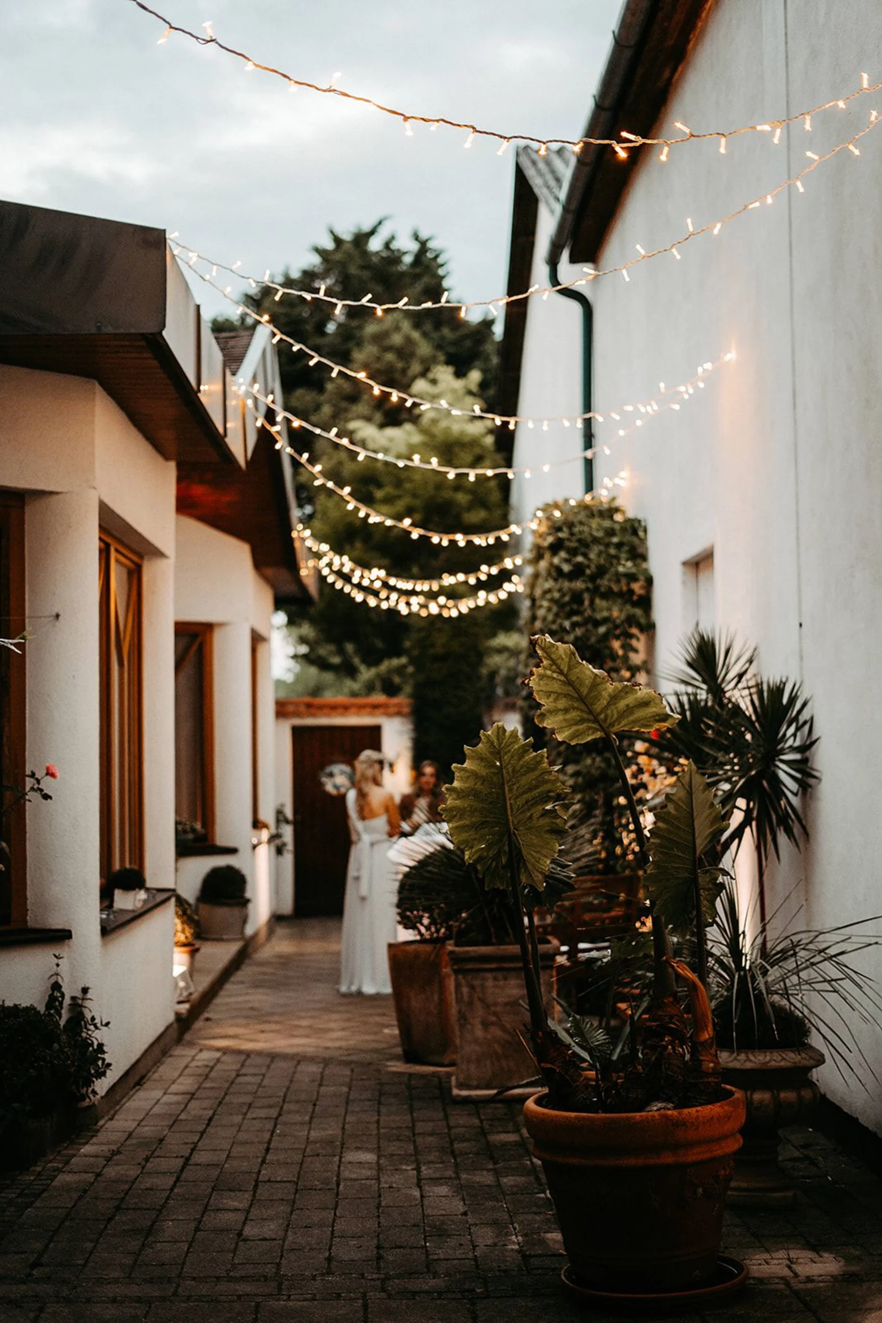 Inner courtyard of Gasthaus Hirschbeck with fairy lights in the evening
